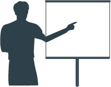 Man in front of a slide presentation.